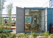 Wijn of Water Shipping Container Restaurant.  Commercial prefab green shipping container sustainable architecture.